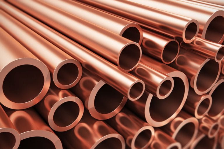 Stack of copper pipes, representing quality materials used by Drain Pros Ventura, a plumber in Ventura.